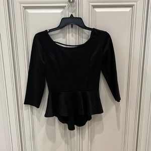 Black top with open back and bow detail